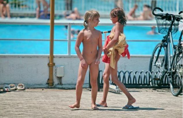Young and adult nudists in an aquapark Young and adult nudists in an aquapark