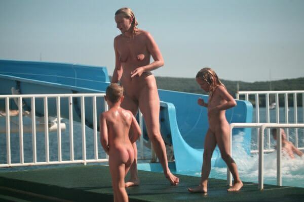 Family nudism - a roller coaster in an aquapark Family nudism - a roller coaster in an aquapark