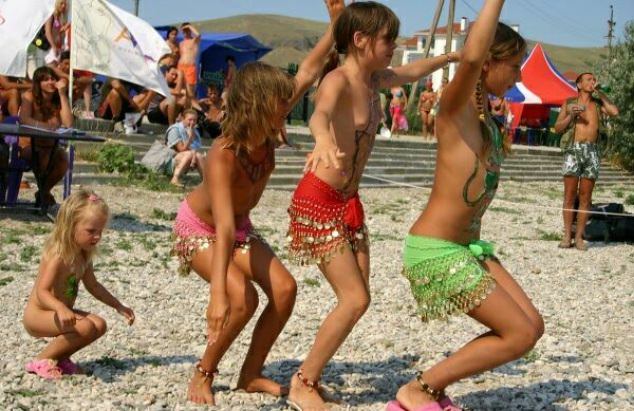 Family nudism on a beach - dances and competitions Family nudism on a beach - dances and competitions